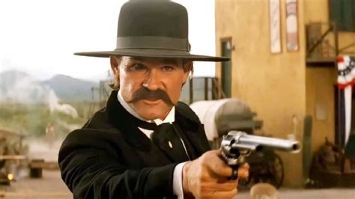 Joel who once played Wyatt Earp in film Crossword Clue